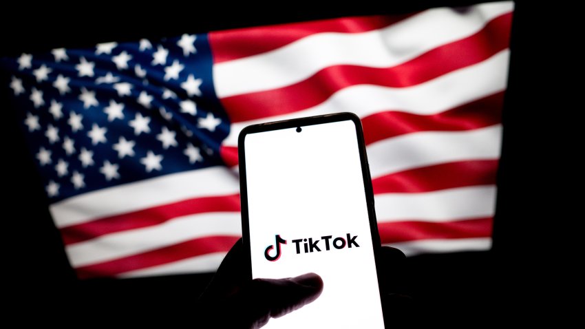 The TikTok logo appears on a smartphone with the flag of the United States